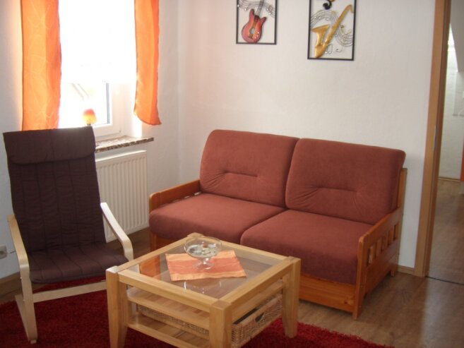 Bild 7 Wohnzimmer mit Doppelbettsofa